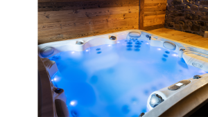 An indoor hot tub with cloudy water.