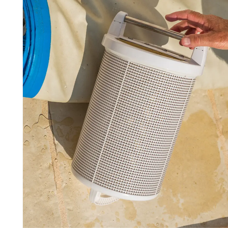 A pool filter getting set down on the edge of a pool