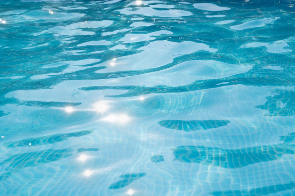 Overhead shot of pool water that gleams in the sunlight