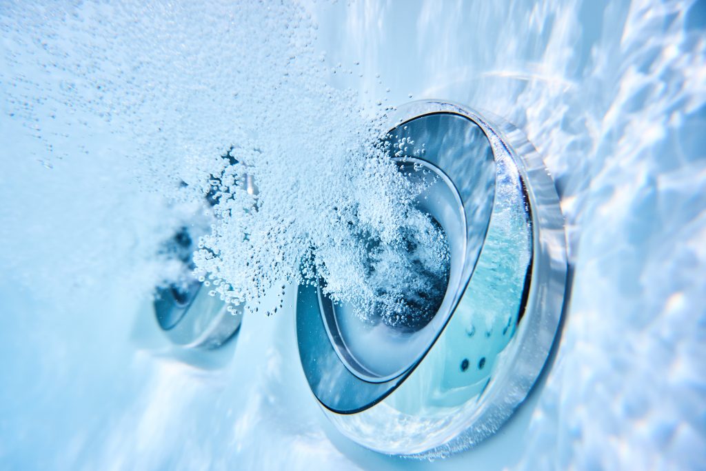 Underwater shot of silver hot tub jets
