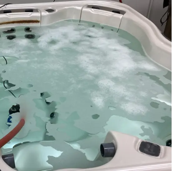 A closeup shot of a hot tub that is dirty with mold and mildew. It needs to be cleaned.